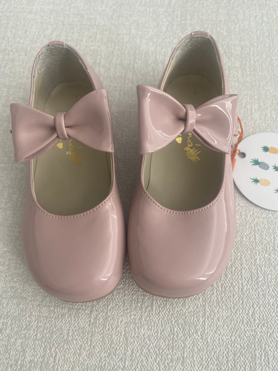 Pink patent leather bow shoes